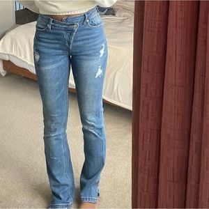 Ripped Jeans w/ Crossover Buttons by Akira